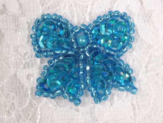 0185  Turquoise Bow Sequin Beaded Applique 1.25